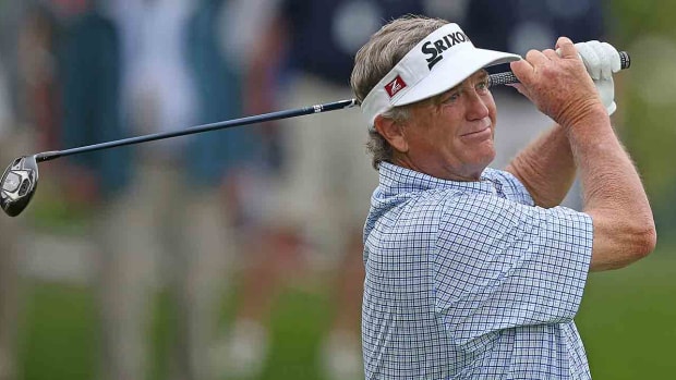 Peter Jacobsen watches his tee shot on the 14th hole during the first round of the 2023 KitchenAid Senior PGA Championship at Oak Hill Country Club.